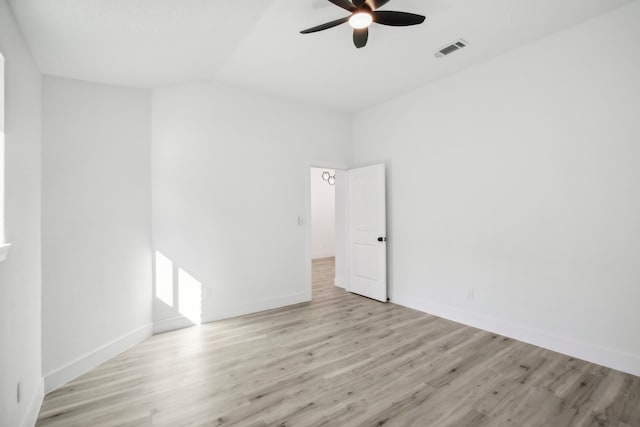 unfurnished room with vaulted ceiling, light wood-type flooring, and ceiling fan