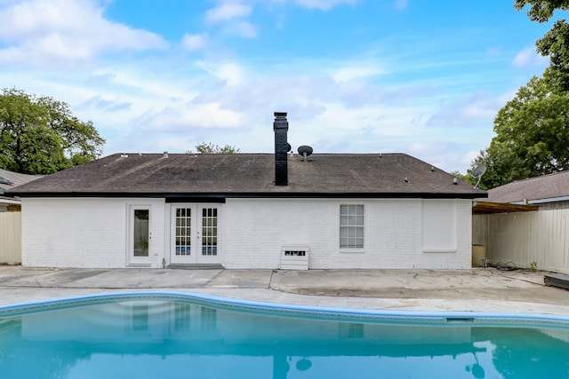 rear view of property featuring a patio and french doors