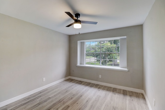 unfurnished room with ceiling fan and light hardwood / wood-style flooring