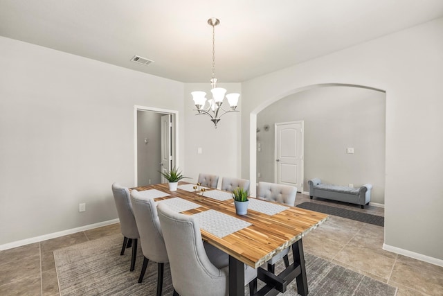 dining space featuring an inviting chandelier