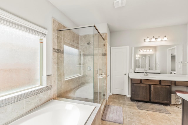 bathroom featuring vanity, plus walk in shower, and tile patterned floors