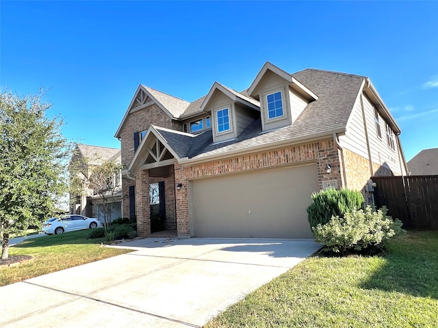 view of front of property featuring a front yard and a garage