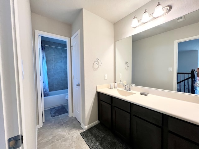 full bathroom featuring vanity, toilet, shower / bathtub combination with curtain, and tile patterned floors