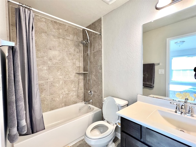 full bathroom featuring toilet, shower / bath combo, and vanity