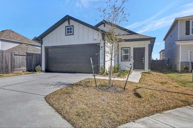 view of front facade with a front yard and a garage