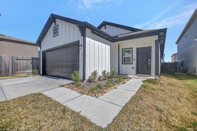 ranch-style home featuring a front yard and a garage