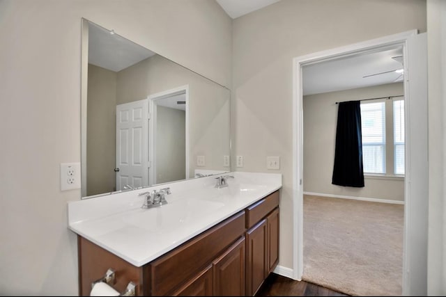 bathroom with vanity and hardwood / wood-style flooring