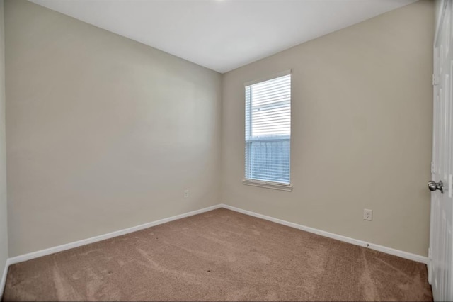 empty room featuring light carpet