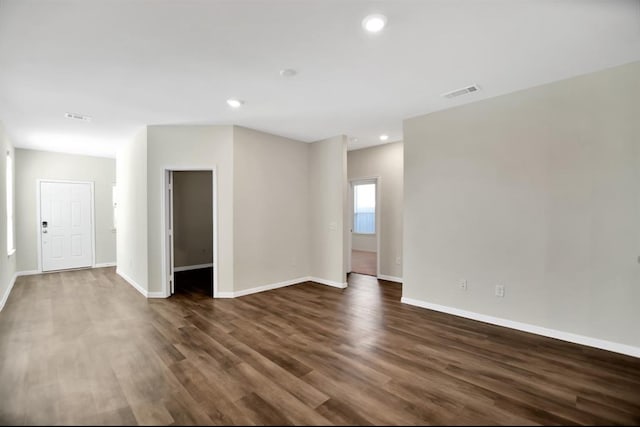 spare room featuring dark hardwood / wood-style floors