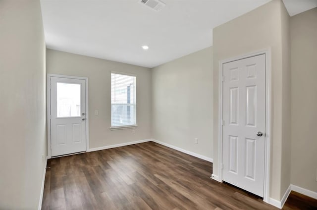 unfurnished room with dark hardwood / wood-style floors