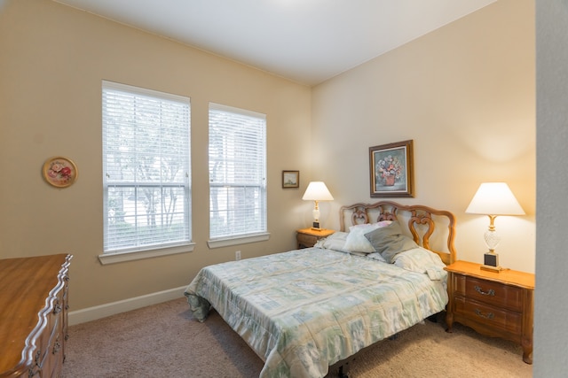 bedroom featuring light carpet