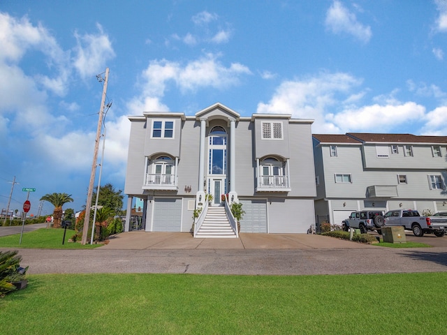 view of front of home with a garage and a front lawn