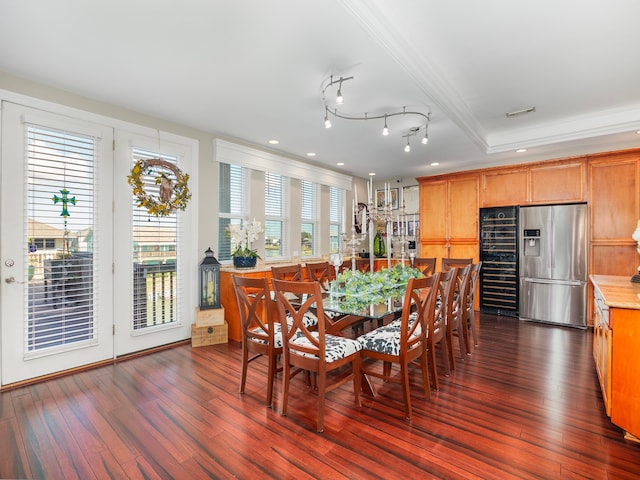 dining area with wine cooler and dark hardwood / wood-style floors