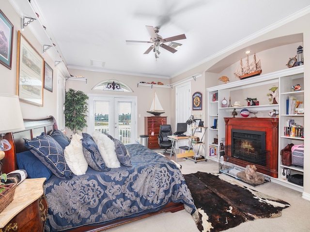 carpeted bedroom with crown molding, french doors, access to outside, and ceiling fan