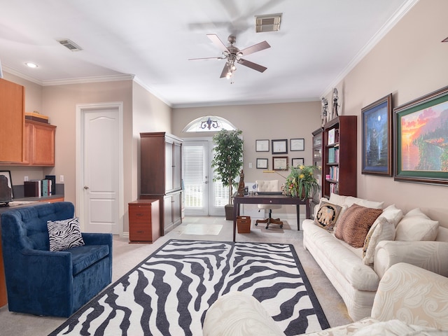 carpeted living room featuring ornamental molding and ceiling fan