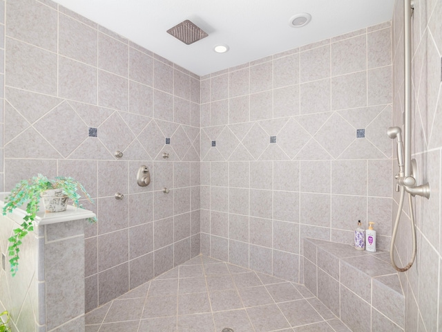 bathroom with tiled shower