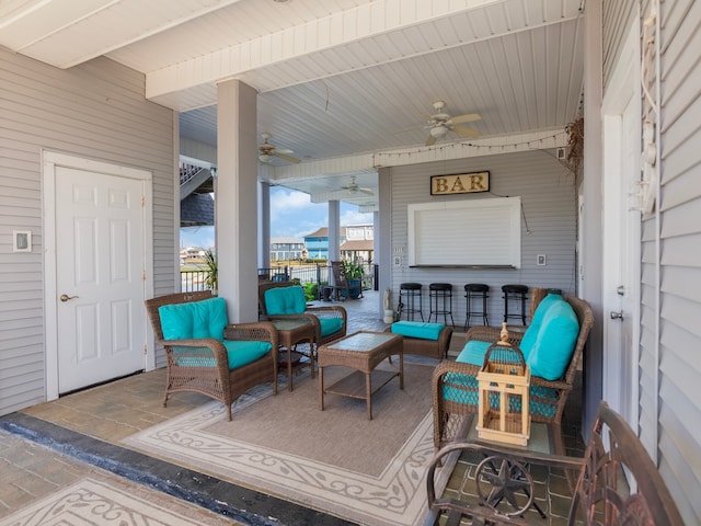 view of patio with outdoor lounge area and ceiling fan