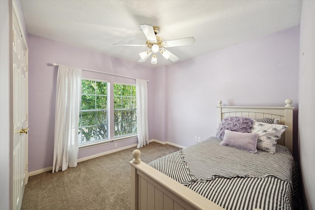 carpeted bedroom with ceiling fan