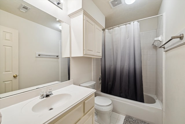 full bathroom featuring vanity, tile patterned floors, shower / bath combo with shower curtain, and toilet