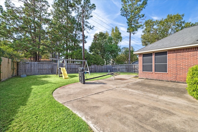 view of yard with a patio area and a playground