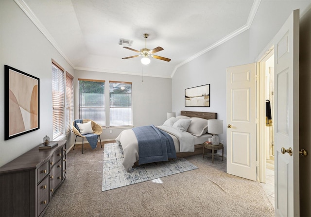 bedroom with visible vents, ornamental molding, baseboards, light colored carpet, and vaulted ceiling