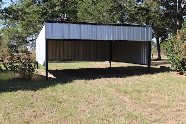 view of outbuilding with a yard