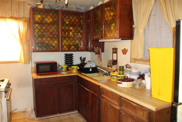 kitchen with sink and white range oven