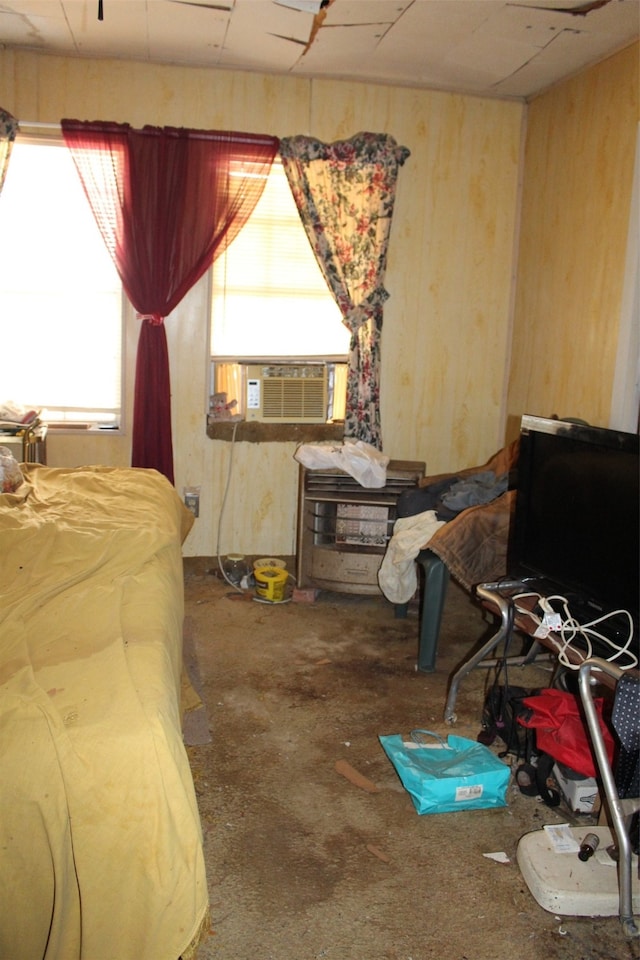 bedroom with cooling unit and concrete floors