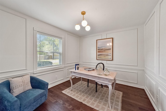 office featuring a decorative wall and dark wood finished floors