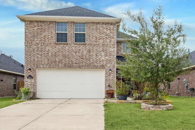 view of front property featuring a garage and a front lawn