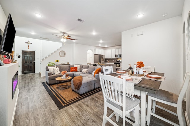 dining area featuring ceiling fan and light hardwood / wood-style flooring