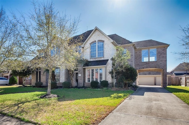 view of front facade featuring a front yard and a garage