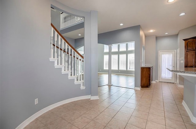 interior space featuring a healthy amount of sunlight and light tile patterned flooring