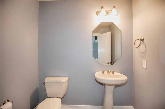 bathroom featuring sink and toilet