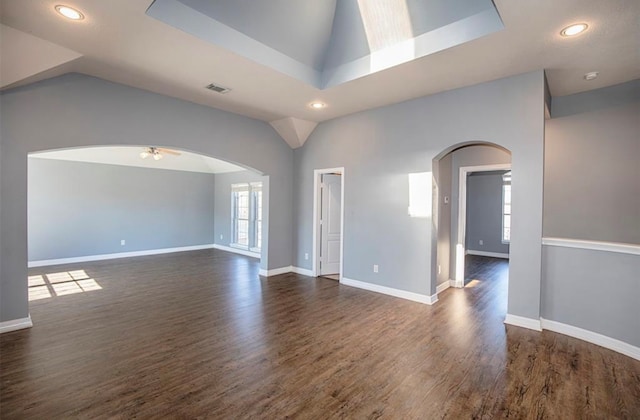 spare room featuring ceiling fan, vaulted ceiling, and dark hardwood / wood-style floors