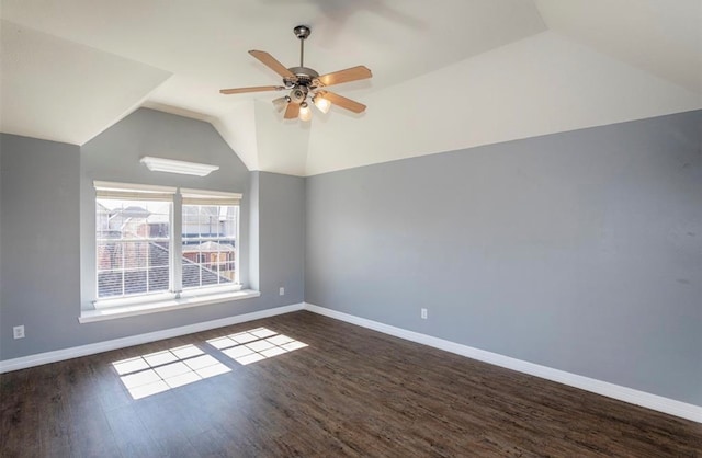 additional living space featuring ceiling fan, vaulted ceiling, and dark hardwood / wood-style flooring