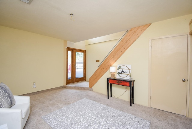 unfurnished room featuring light colored carpet