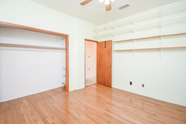 unfurnished bedroom with light wood-type flooring and ceiling fan