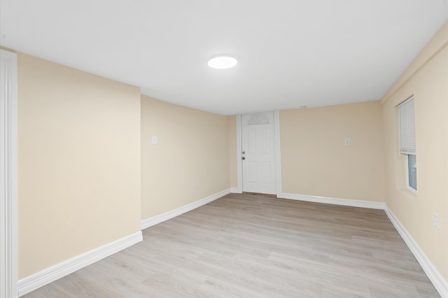 spare room featuring light hardwood / wood-style floors