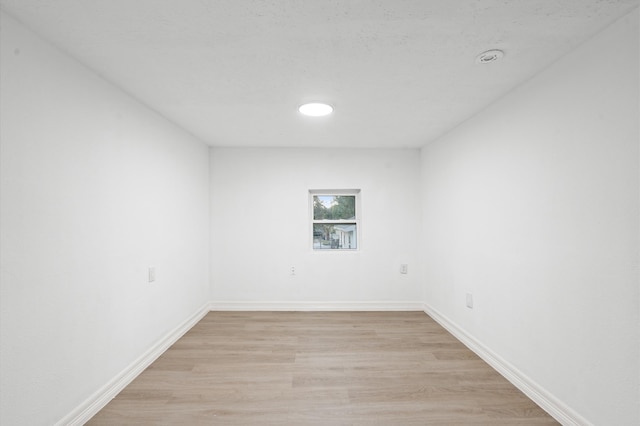 unfurnished room featuring light wood-type flooring