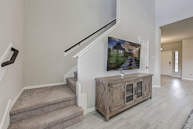 staircase with wood-type flooring