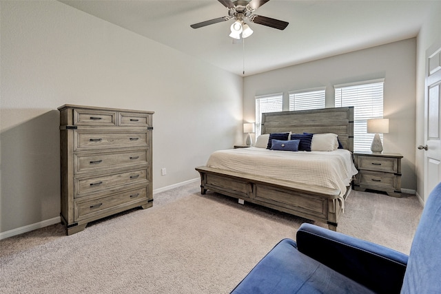 bedroom featuring ceiling fan and light carpet