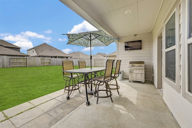 view of patio with a grill