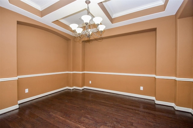 unfurnished room featuring an inviting chandelier, ornamental molding, and dark hardwood / wood-style flooring