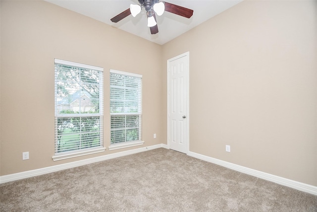 unfurnished room featuring ceiling fan and light carpet