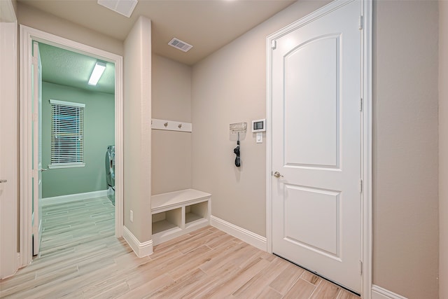 mudroom with light wood-type flooring