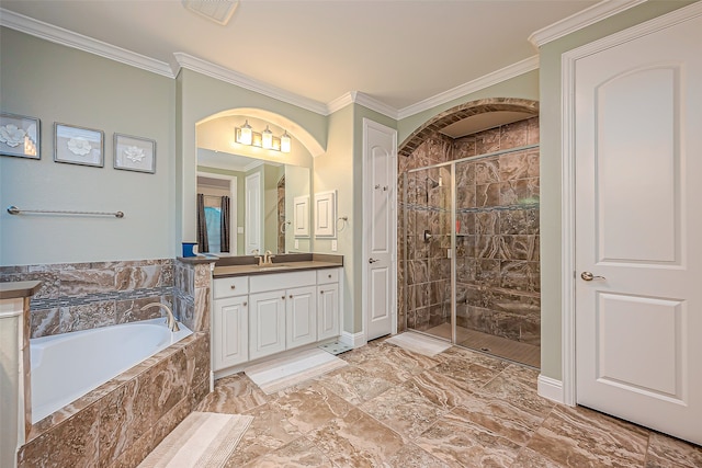 bathroom with vanity, crown molding, and shower with separate bathtub