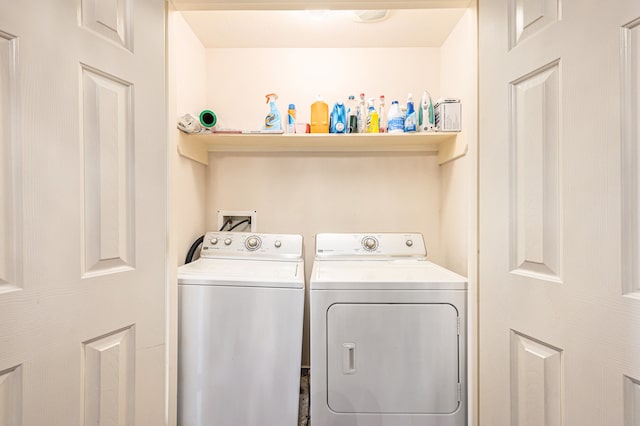 washroom featuring washer and dryer