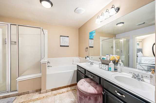 bathroom featuring vanity, plus walk in shower, and tile patterned floors