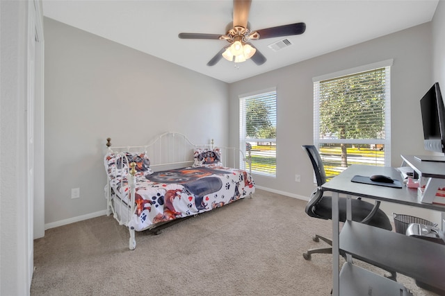 bedroom with light colored carpet and ceiling fan